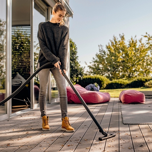 Vacuuming patio deck with the wet and dry vacuum floor nozzle