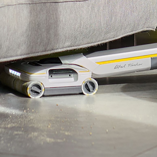 Cleaning the floor under the couch with the floor cleaer signature line