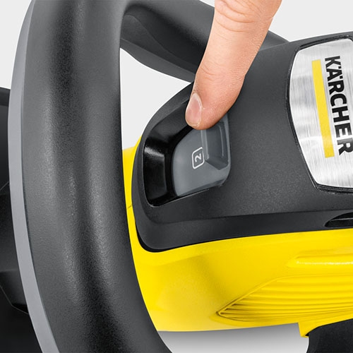 Switching between the two speed options for the hedge trimmer