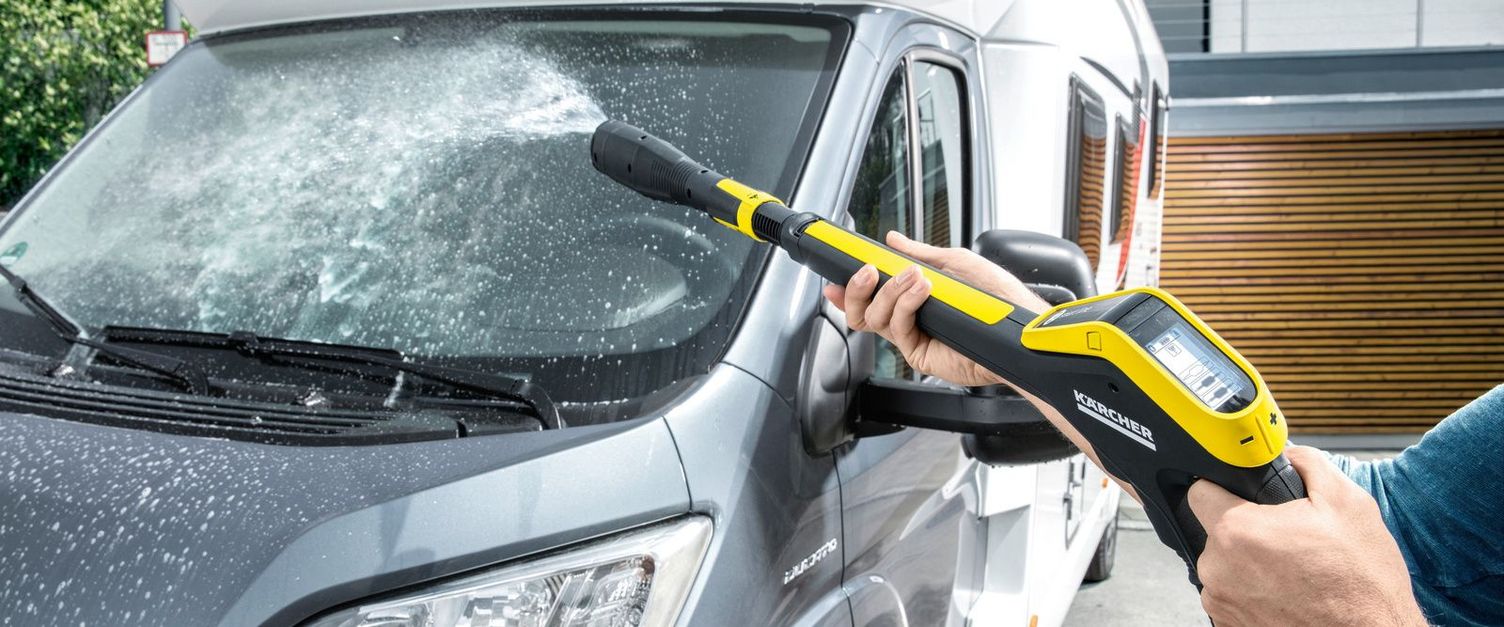 A cravan is cleaned with a Kärcher pressure washer