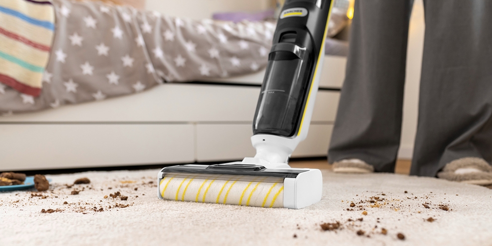 Vacuuming carpet with vacuum mop
