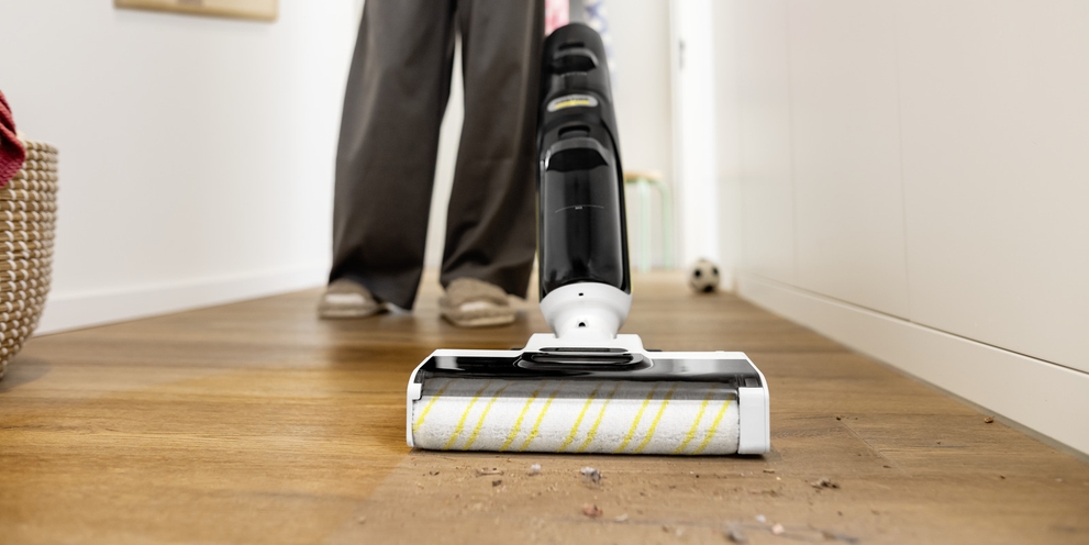 Vaccum mop cleaning stone floor in the dining room