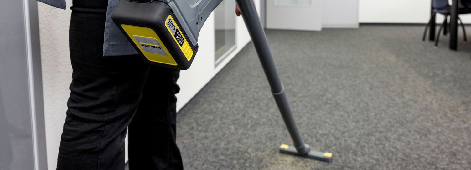cleaning carpet with battery powered vaccum