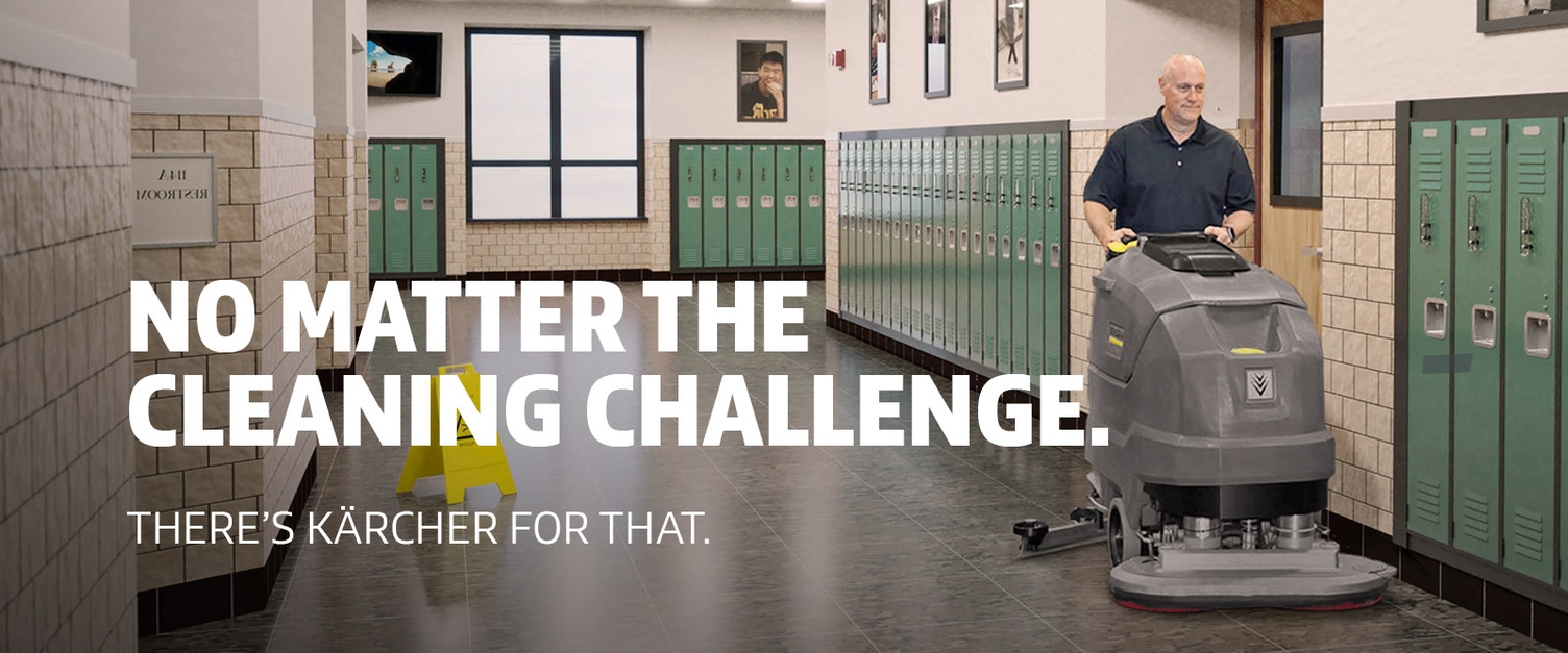 Education Industry Cleaning Solutions A worker cleans school hallways with a walk-behind floor scrubber.