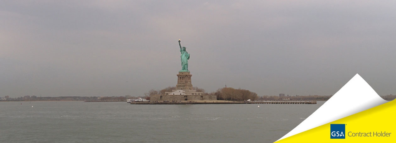 Photo of the Statue of Liberty with the GSA logo in the bottom right corner
