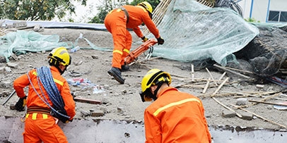 Disaster relief workers take care of business in harsh conditions.