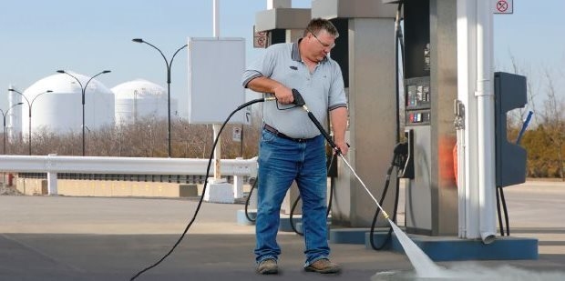 Fuel Stations and Parking Lots A Kärcher Pressure Washer is being used to clean fuel spills at a gas station.