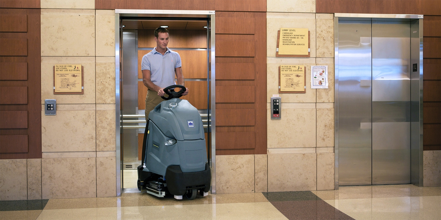 Windsor Kärcher Group A worker uses a Windsor Kärcher Group floor scrubber.