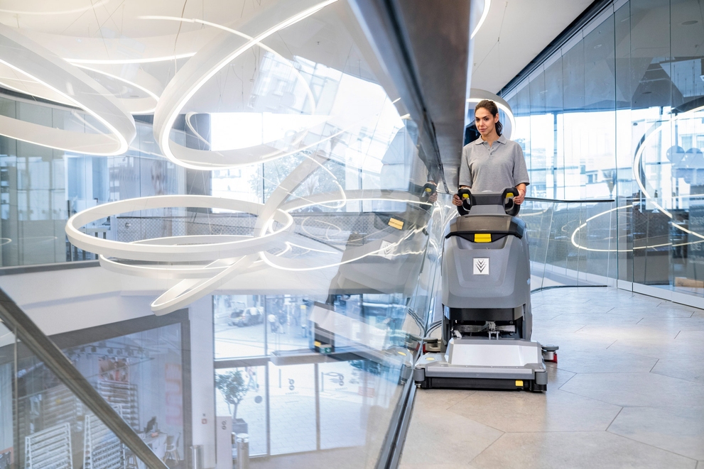 B 50 Walk-Behind Floor Scrubber A worker uses a Kärcher B 50 Walk-Behind Floor Scrubber in a shopping center.