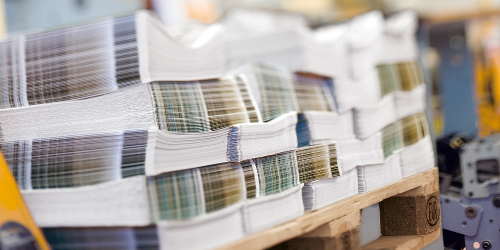 A stack of pamphlets off the press.