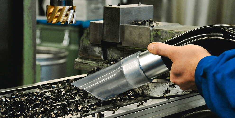 Industrial Vacuum Accessories Kärcher vacuum nozzle sucking up metal debris.