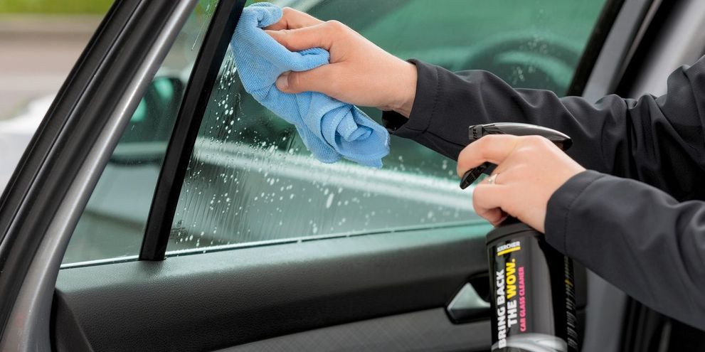 Clean glass surfaces with car glass cleaner Glass surface is cleaned with Kärcher car glass cleaner