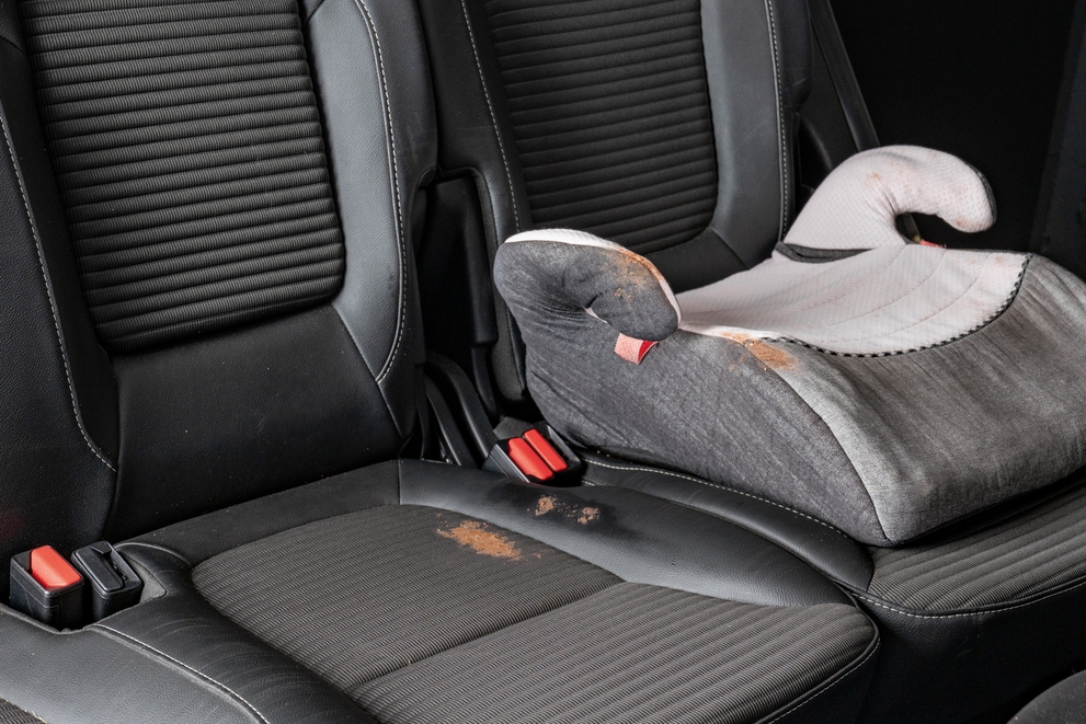 Vehicle Interiors: Before A dirty child seat before dry ice cleaning.