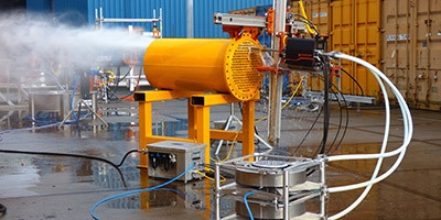 Industrial Pipe & Container Cleaning A container is shown being cleaned with ultra-high pressure water jetting systems.