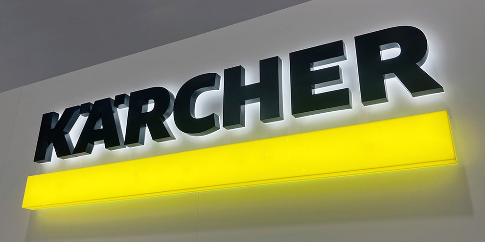 A lit wall sign of Kärcher's logo.