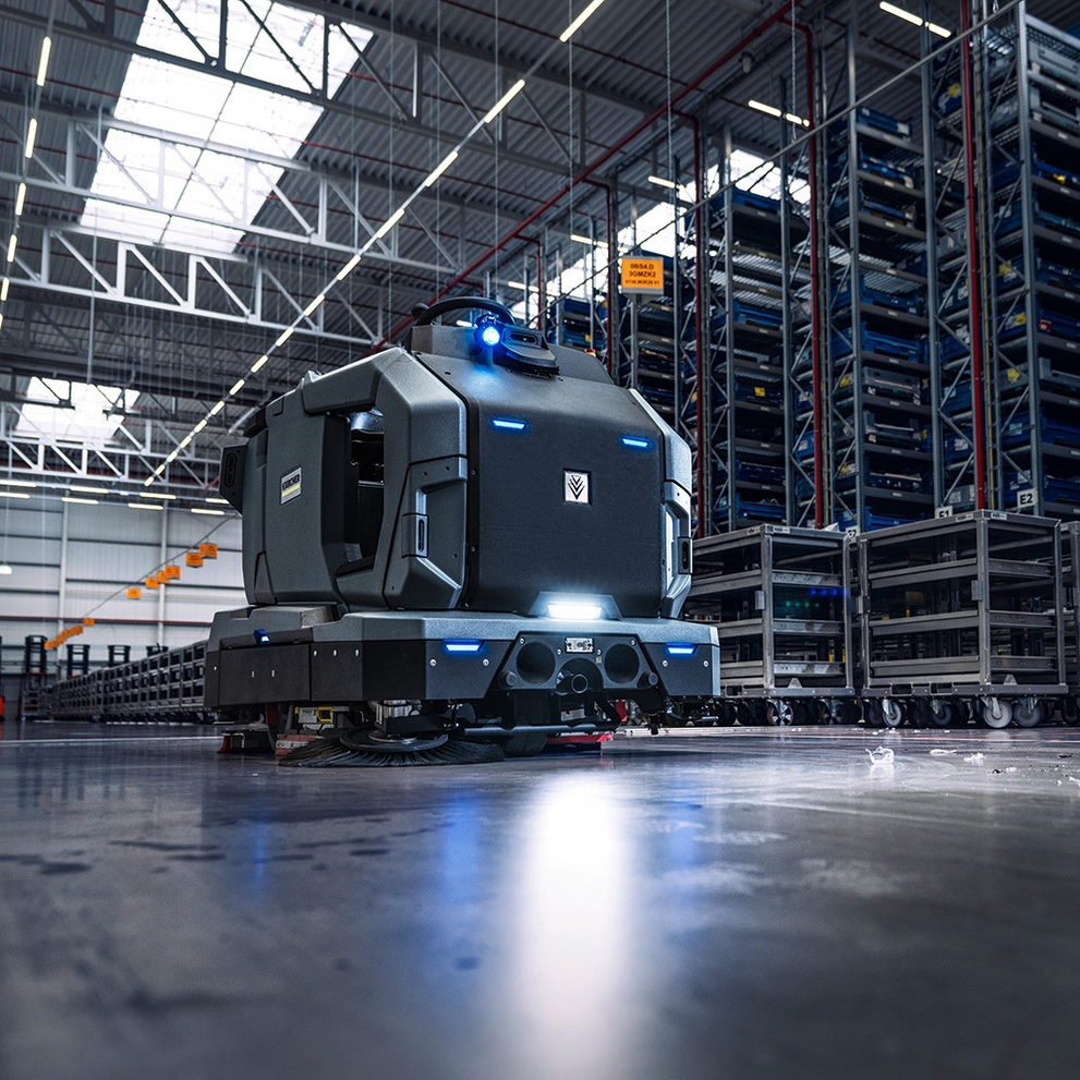 KIRA B 200 Autonomous Floor Scrubber rolls through an industrial setting.