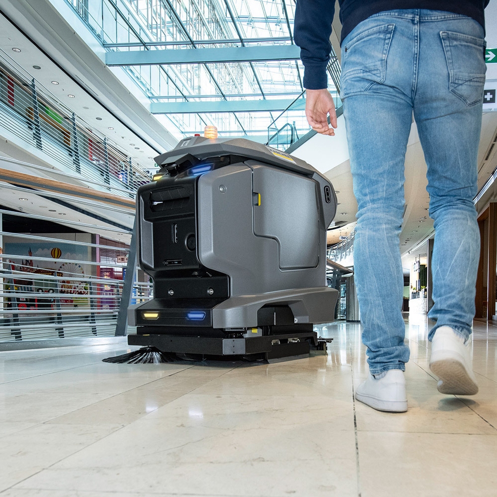 A KIRA B 50 Scrubber cleans floors in a shopping mall.