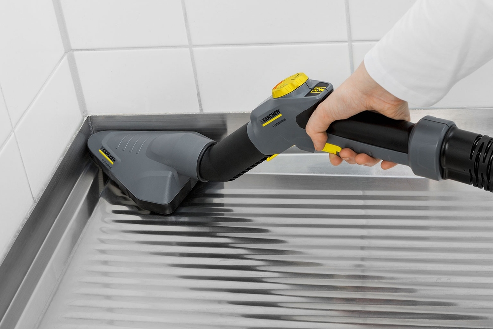 Triangular Floor Nozzle Kärcher triangular floor nozzle shown cleaning a floor corner.