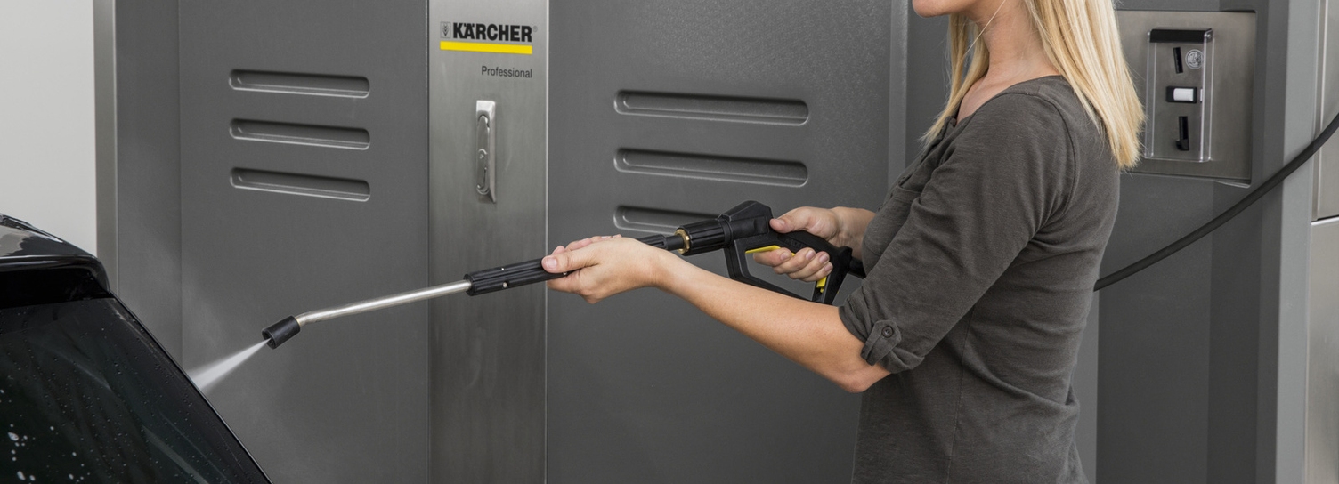 Sustainable Products Self-Service Car Washes A person washes a car using a Kärcher washing system