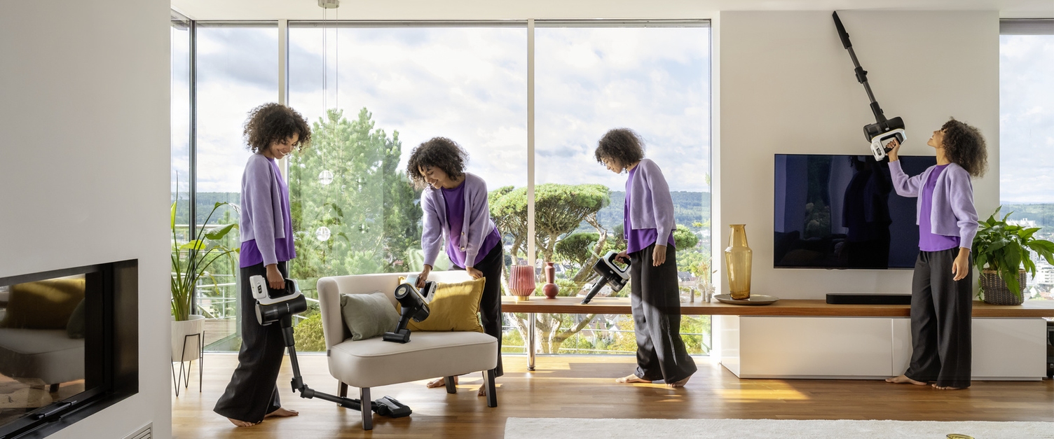 Maximum flexibility: discover the versatile accessories for Kärcher battery-powered vacuum cleaners Woman using a Kärcher battery-powered vacuum cleaner to clean floors, upholstery and high ceilings in a living room.